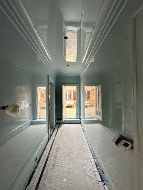 A completed high gloss painting project in a hallway