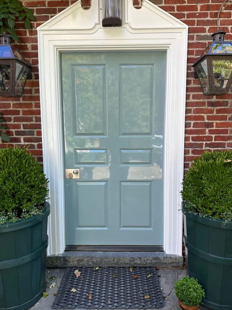 A residential door exterior painted with high gloss paint