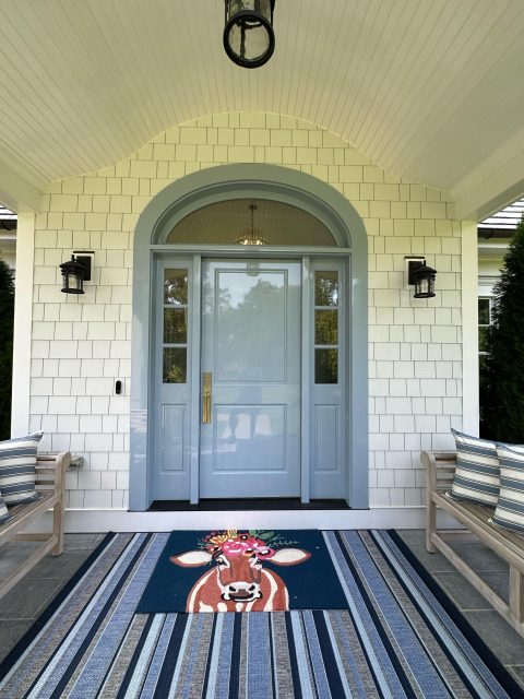 The exterior of a residential front door painted with high gloss paint